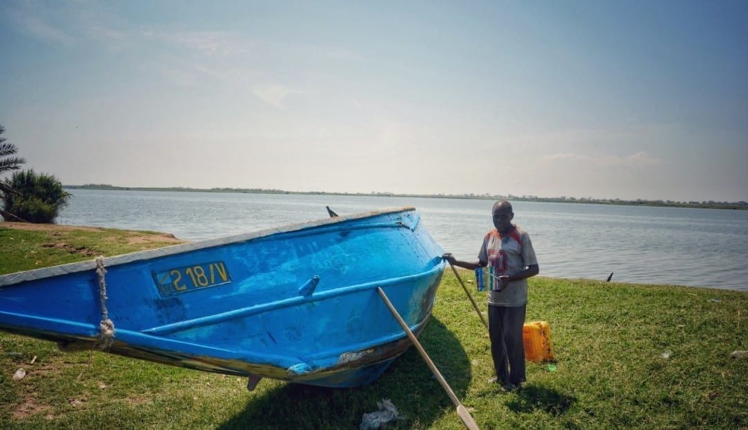 A proud fisherman with his boat